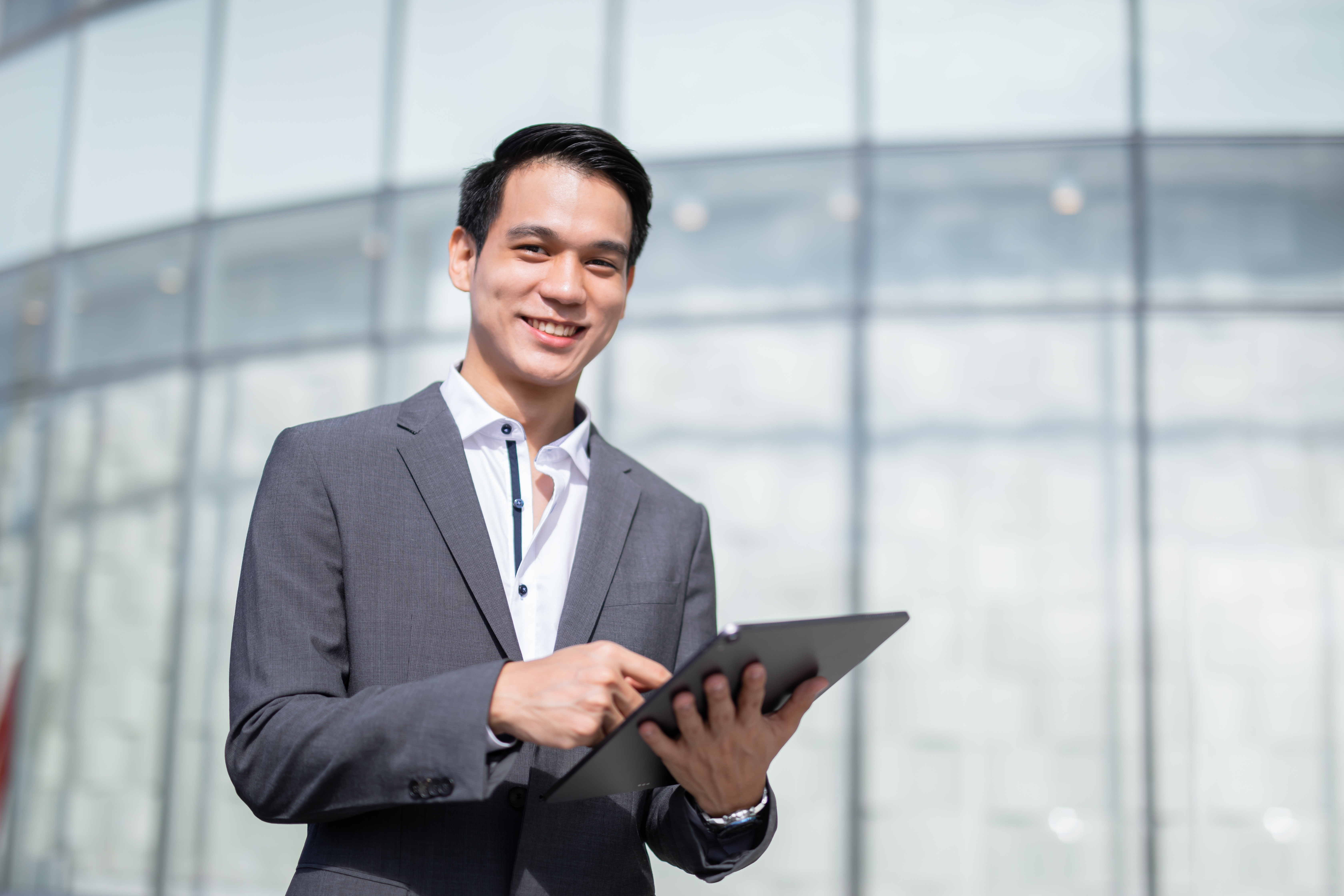 a man holding a tablet