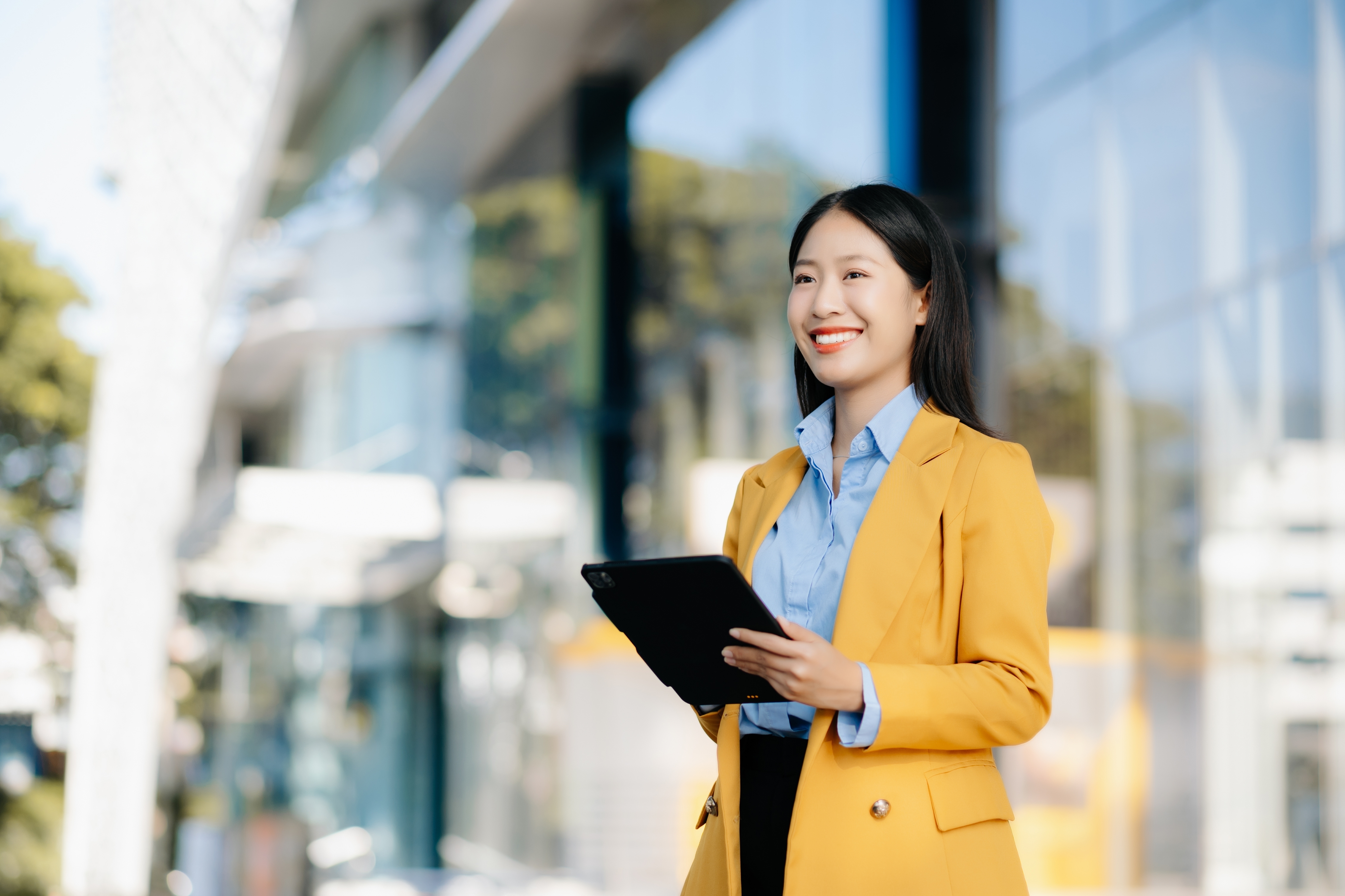 a finance expert holding her tablet